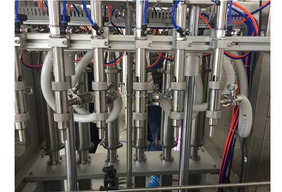 Automatic fluid bottling machine filling capping and labeling machine