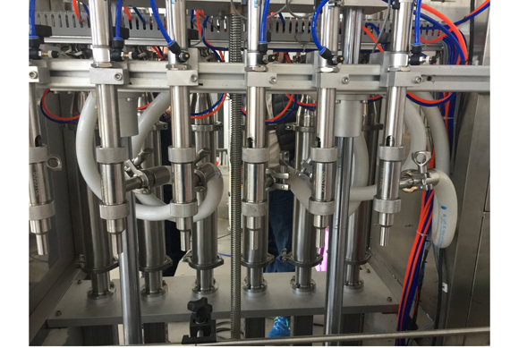 Auto volumetric liquid PE bottle filling machine